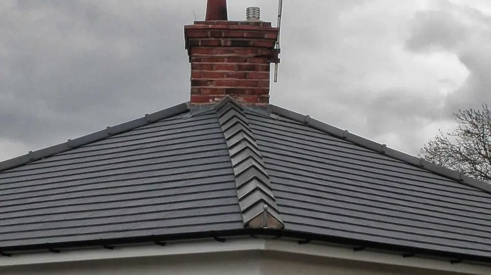 Tiled hip roof, ridge and chimney flashing