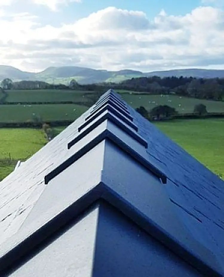 Slate roof ridge with the hills behind
